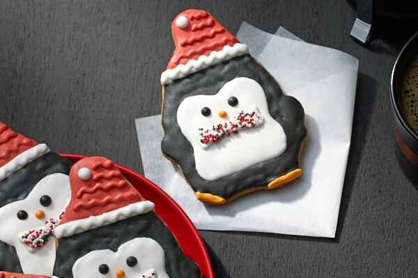 Gingerbread Cookie (P55). A penguin gingerbread cookie decorated with sugar icing.