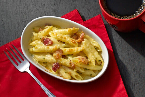 Penne Al Formaggio (P165). A childhood favorite, al dente penne pasta is topped with creamy and sharp cheese sauce made with cheddar, parmesan, and mozzarella.