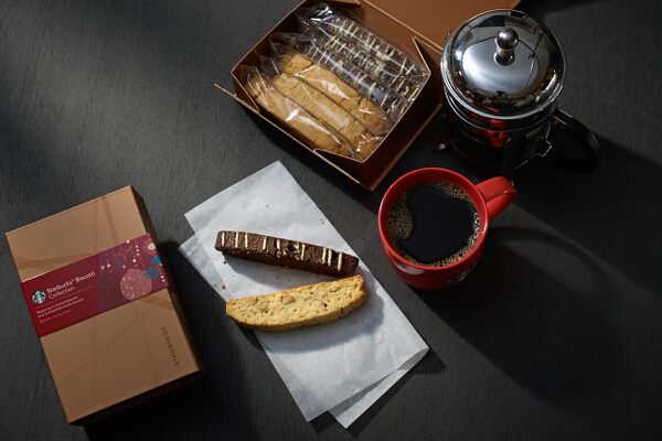 Starbucks Biscotti Collection (P545). This new Starbucks packaged food features three almond biscotti and three chocolate chunk biscotti. These classic, twice-baked cookies--a complement to your coffee--have a subtle sweetness and satisfying crunch.